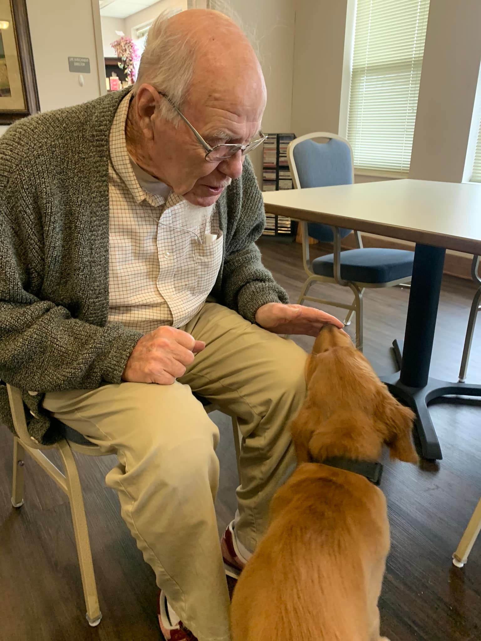 Resident with pet at Rock Creek Senior Living in Ankeny, IA