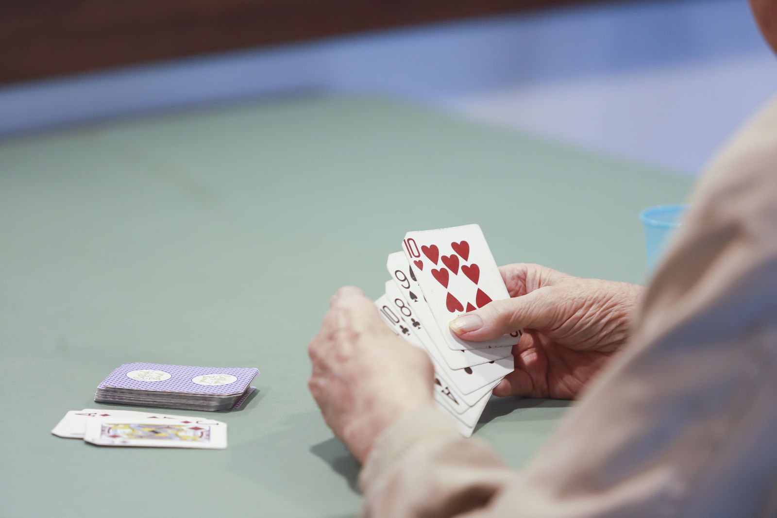 Resident playing cards at Rock Creek Senior Living in Ankeny, IA
