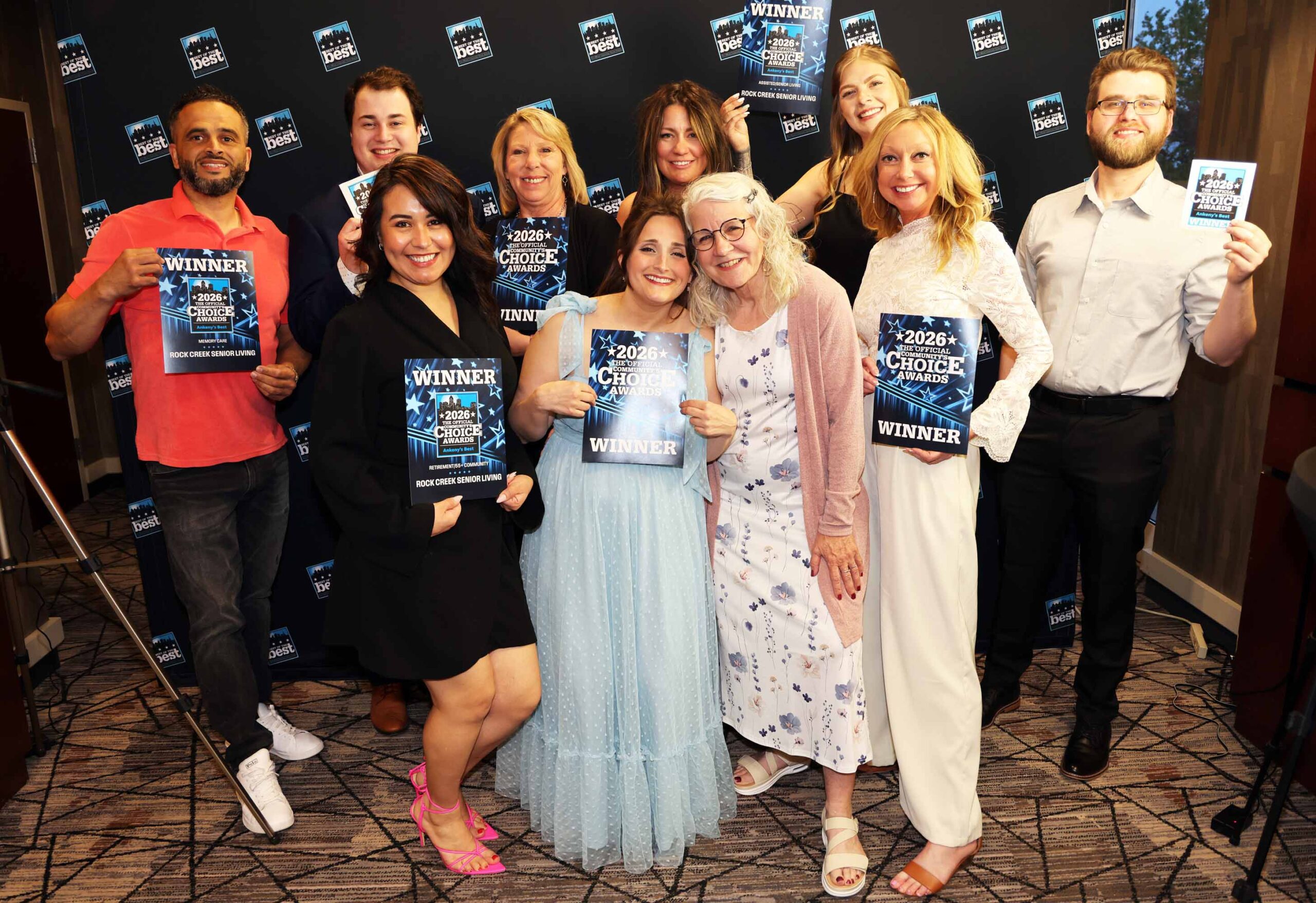 Rock Creek Senior Living team members celebrate winning Ankeny’s Best awards while holding 2026 Community Choice Awards signs.